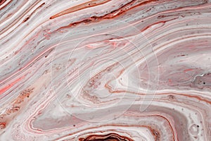 Swirls of marble or the ripples of agate. Liquid marble texture with pink and brown colors. Abstract painting background