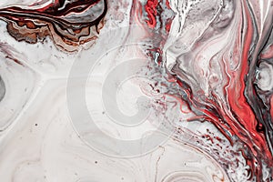 Swirls of marble or the ripples of agate. Liquid marble texture with pink, white and brown colors. Abstract painting