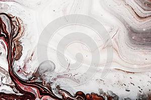 Swirls of marble or the ripples of agate. Liquid marble texture with pink, white and brown colors. Abstract painting