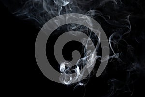 Swirls of smoke on a black