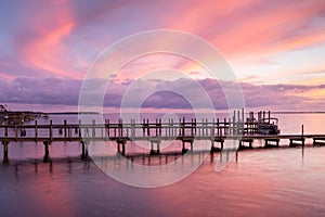 Swirly Pink Sunset Sky over Dock in Duck NC