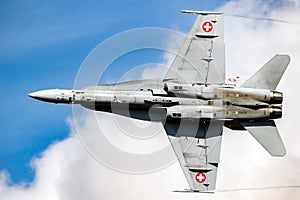 Swiss Air Force McDonnell Douglas F/A-18 Hornet fighter jet plane in flight above Kleine-Brogel Airbase. September 8, 2018