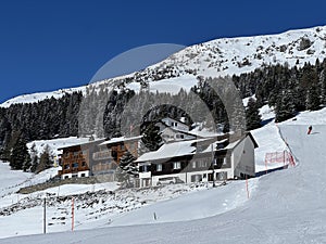 Swiss alpine holiday homes, mountain villas and holiday apartments in the winter ambience of the Alpine tourist resorts