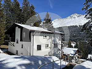 Swiss alpine holiday homes, mountain villas and holiday apartments in the winter ambience of the Alpine tourist resorts