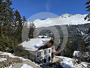 Swiss alpine holiday homes, mountain villas and holiday apartments in the winter ambience of the Alpine tourist resorts