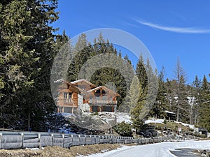 Swiss alpine holiday homes, mountain villas and holiday apartments in the winter ambience of the Alpine tourist resorts