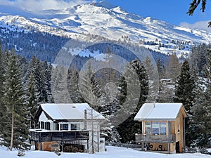 Swiss alpine holiday homes, mountain villas and holiday apartments in the winter ambience of the tourist resort of Lenzerheide