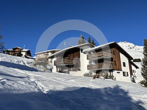 Swiss alpine holiday homes, mountain villas and holiday apartments in the winter ambience of the winter resort of Arosa