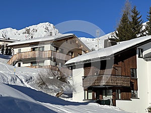 Swiss alpine holiday homes, mountain villas and holiday apartments in the winter ambience of the winter resort of Arosa