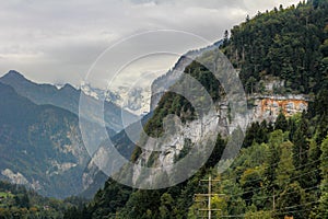 Swiss alps cliff, mountains and valley.