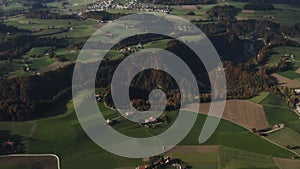 Swiss alps drone view with mountains, meadows and forest