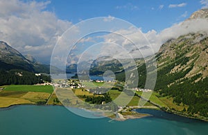 Swiss Alps: Heli flight over the glacier lakes Silvaplna and Sils in the upper Engadin near St.MOritz