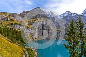 Swiss Alps, Kandersteg, Lake Oeschinensee, Bernese Oberland, Europe. A scenic depiction of a popular tourist attraction.