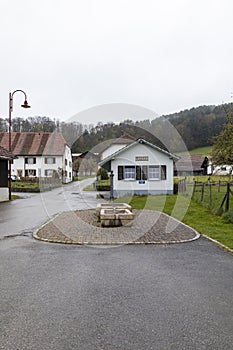 Swiss Alps village in Canton Jura with characteristic houses on a cloudy day