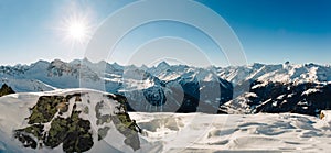 Swiss alps winter panoramic with sun flare