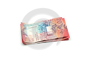 Swiss bank notes of twenty francs on white background