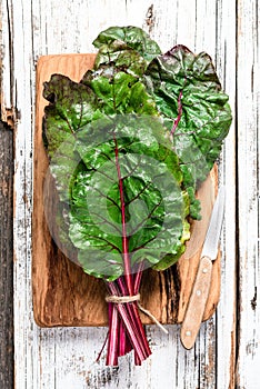 Swiss chard leaf on wooden background