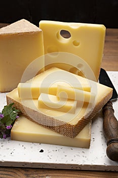 Swiss cheese collection, holes emmentaler and gruyere cheese made from unpasteurized cow`s milk