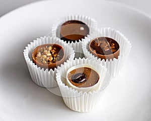 Swiss chocolate pralines on a white plate