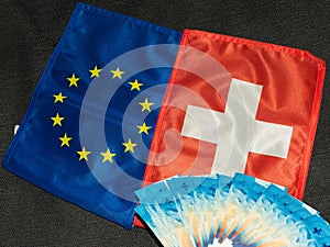 Swiss and european flag with swiss franc bills 27.5.2021