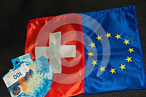 Swiss and european flag with swiss franc bills 27.5.2021