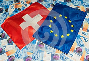 Swiss and european flag with swiss franc bills in cash 27.5.2021