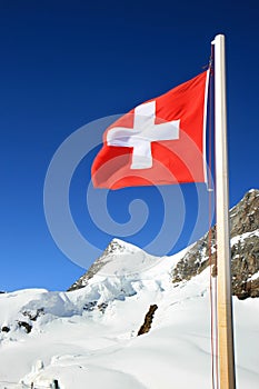 Swiss flag at the snow fields of the Jungfrau