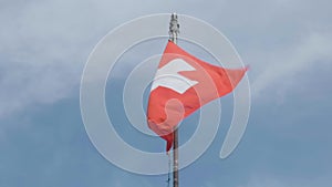 Swiss flag, white cross on red background in slow motion. Switzerland