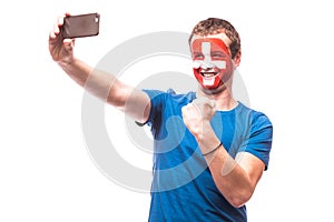 Swiss football fan take selfie photo with phone on white background