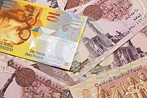 A Swiss franc bank note with Egyptian one pound bank notes