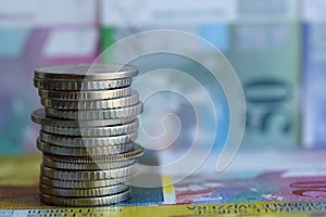 Swiss franc banknotes and coins. The current francs money bills and coins lies in big amount photo