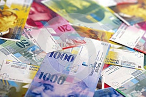 Swiss franc banknotes. The current francs money bills lies on table in big amount photo