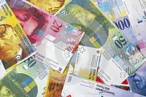 Swiss franc banknotes. The current francs money bills lies on table in big amount photo