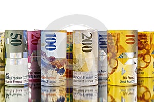 Swiss franc, banknotes rolled up in rolls