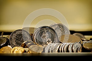 Swiss franc coins lie on a light background
