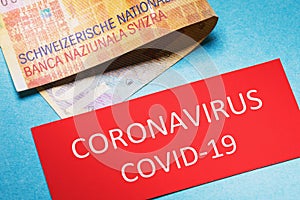 Swiss francs and tag with the inscription. Coronavirus concept