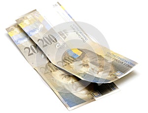 Swiss francs on white