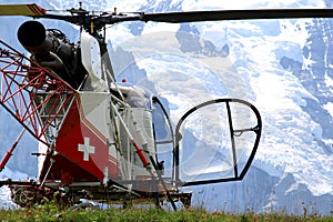 Swiss helicopter in the mounts of Bernese Oberland photo