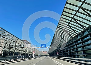 Swiss highway with noise barrier close to border crossing Como Chiasso, Italy.