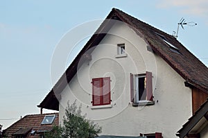 Swiss house with red windows