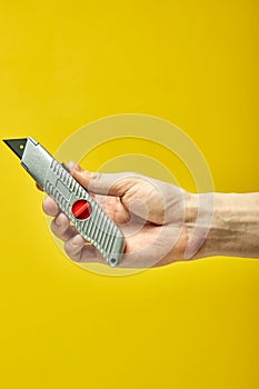 Swiss knife in male hands, used for home repair and cutting