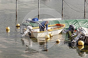 Swiss man in a boat of a lake