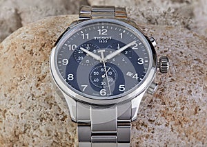 Swiss men's watch with a blue dial, Tissot firms shot on stones