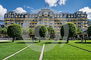 Swiss Montreux Palace hotel surrounded by lush greenery