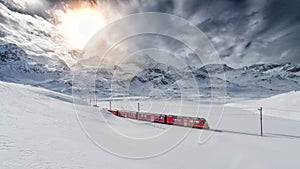 Swiss mountain train Bernina Express crossed through the high mo photo