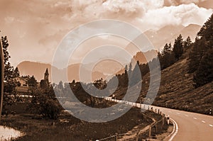 Swiss mountains and glacier lakes given a sepia tone