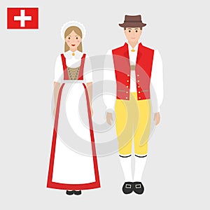 Swiss in national costume with a flag