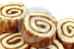 Swiss sweet roll with jam isolated, slices of homemade sponge roll cake isolated