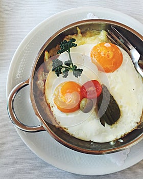 Swiss vegetarian potato rÃ¶sti with sunny side up fried eggs