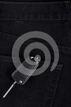 Switch key is lying in back pocket of black pants